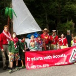 Boat and scouts with banner